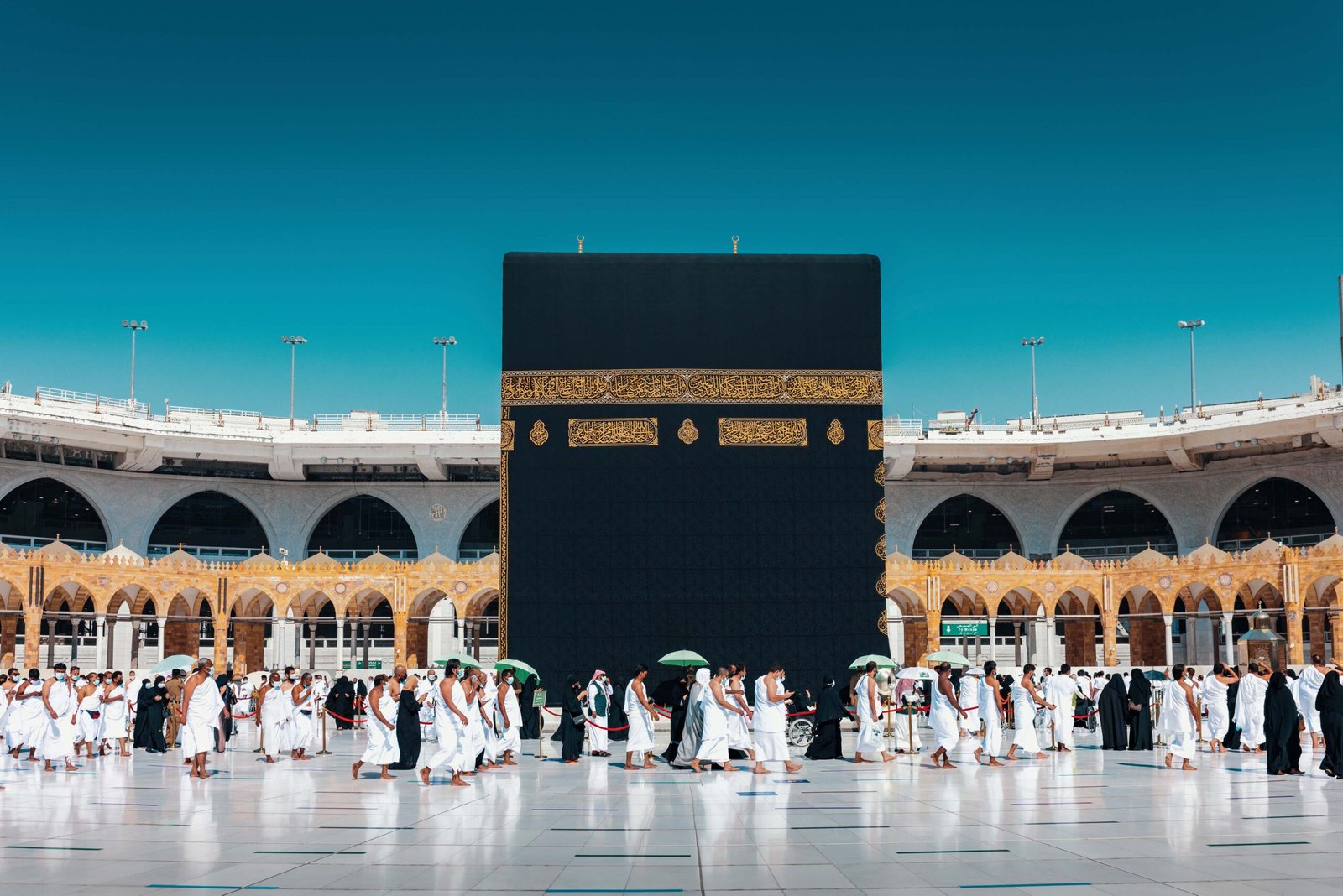 Illuminated Masjid al-Haram and the Holy Kaaba surrounded by pilgrims in Makkah